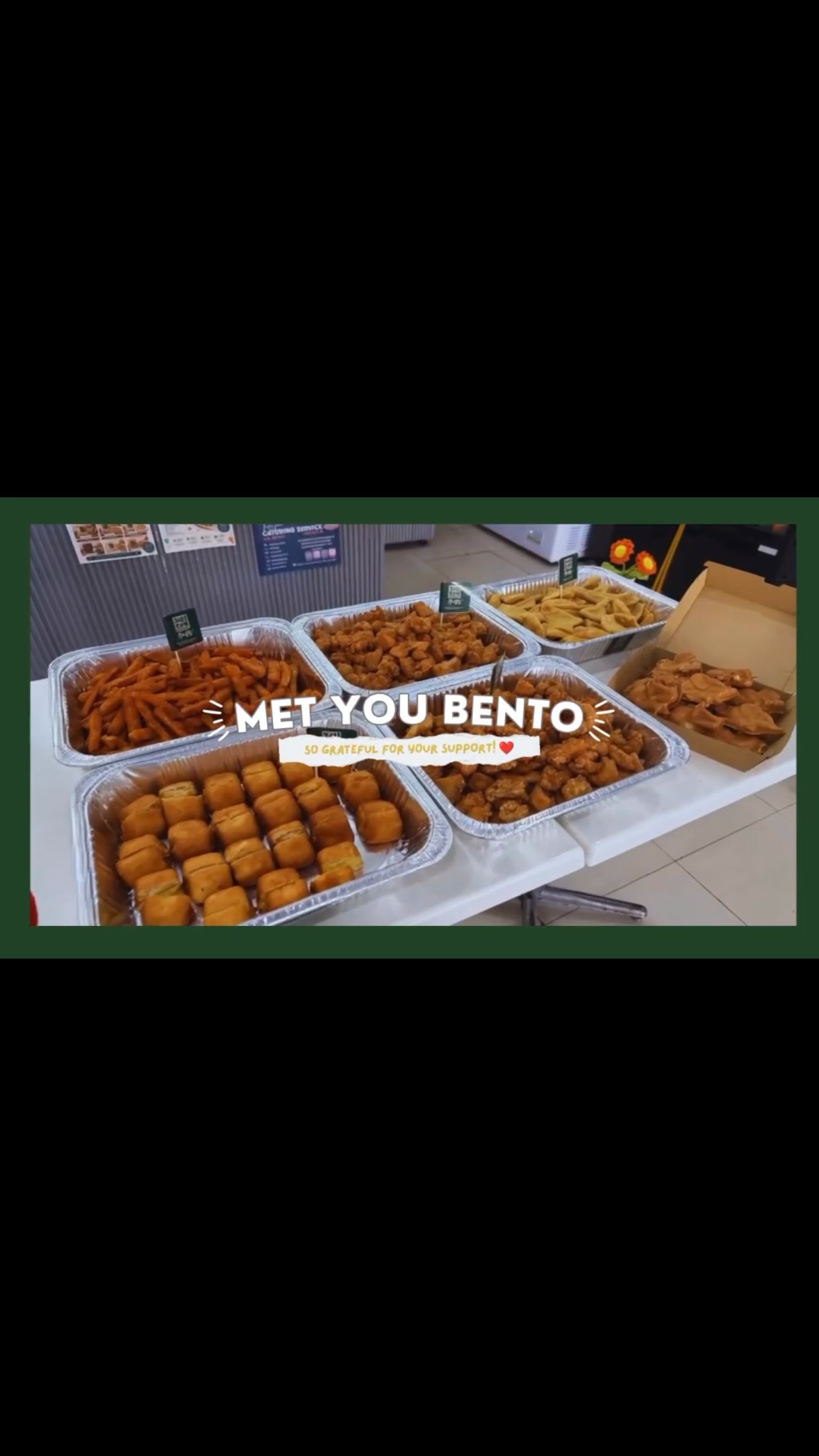 Foil tray of golden fried snacks